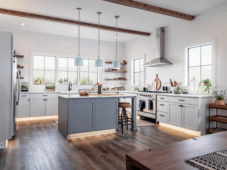 Bright modern kitchen with a gray island, white cabinets, a stainless steel range, and large windows letting in light.