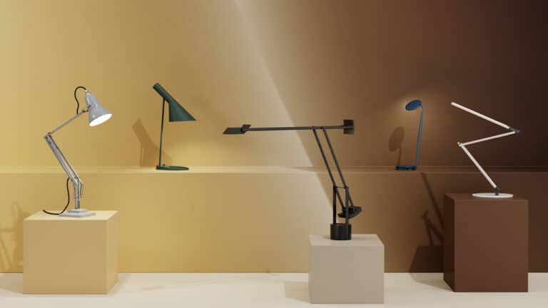 Row of desk lamps on pedestals against a warm gradient wall, showcasing different styles.